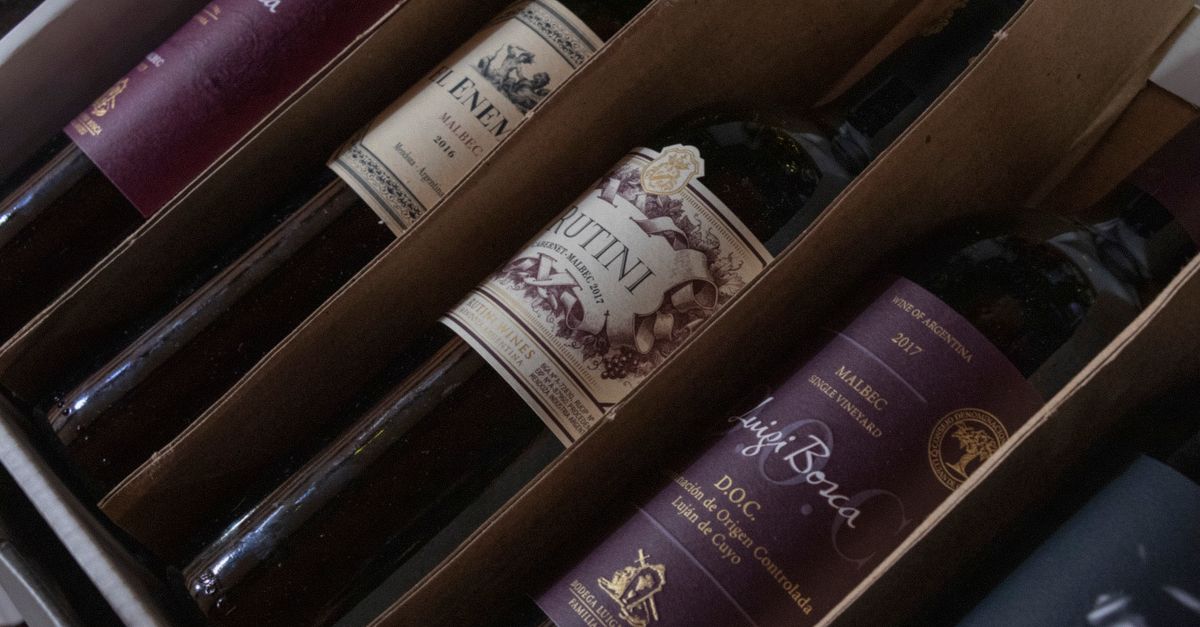 A selection of fine Argentinian wines in a box featuring various labels and vintages, perfect for wine enthusiasts.